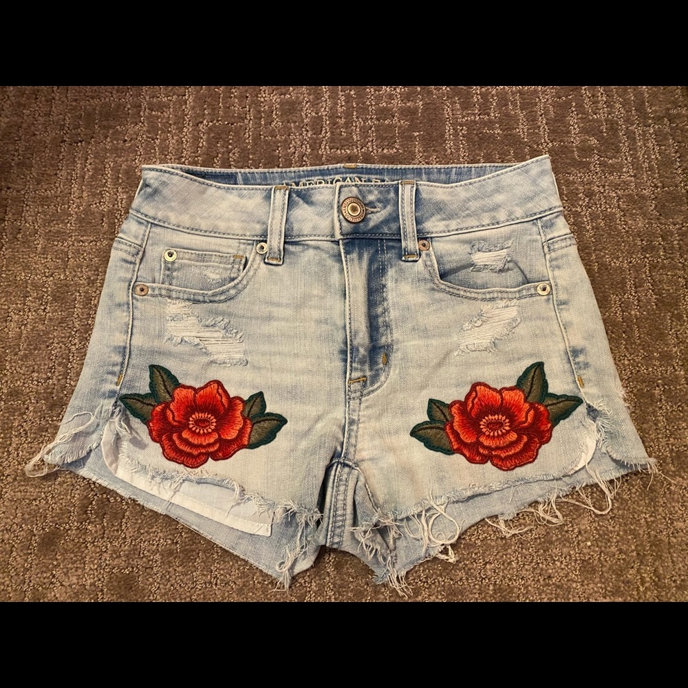 American Eagle jean shorts with rose patches